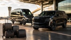 Atlanta luggage travel guide with black luxury Escalade, Sprinter van, and airport luggage